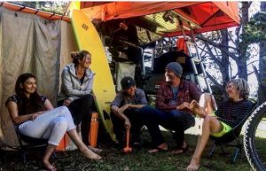 Carol van Stralen and family laughing at campsite overlanding