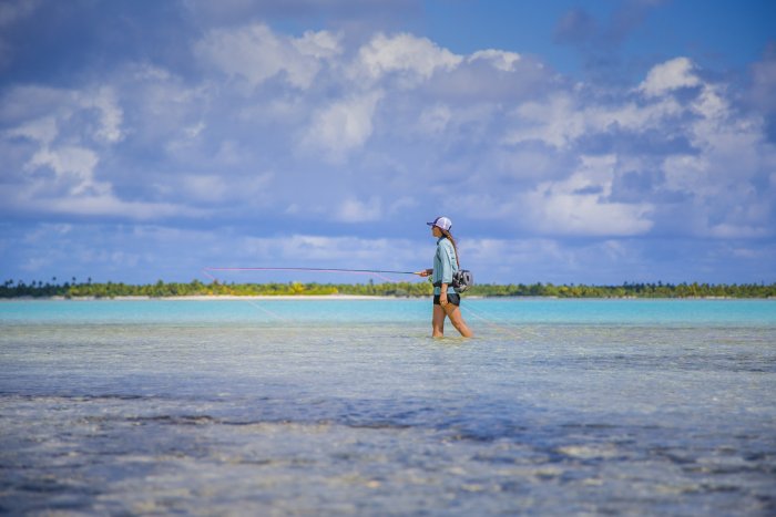 A woman flyfishes in the shallow, tropical waters of Costa Rica.