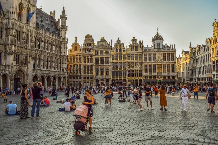 People enjoying the Grand Place, a plaza in Brussels, Belgium.