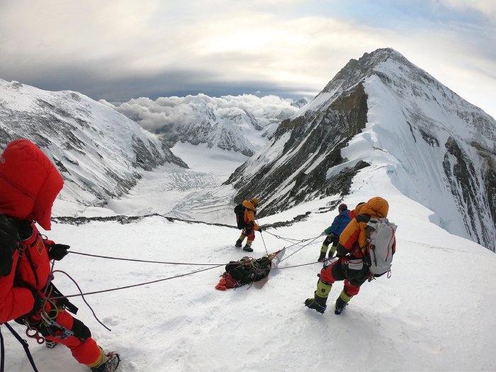 A high-alpine rescue operation in the snowy mountains.