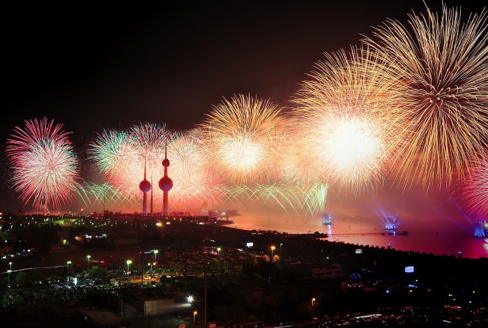 Fireworks above Kuwait Towers light up the night sky.