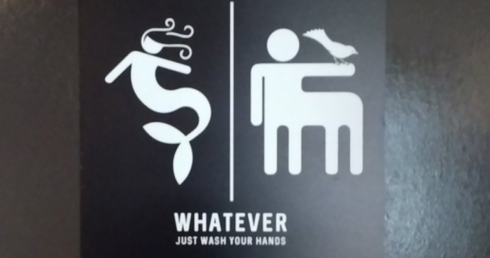 A funny public restroom sign.