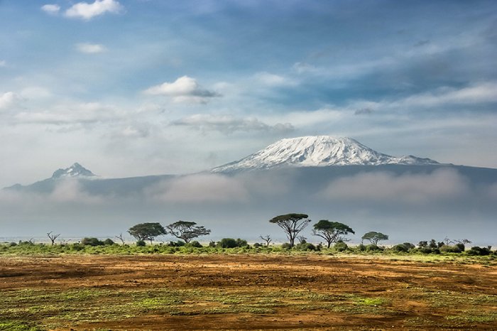 Mount Kilimanjaro, snow-capped on a sunny day.
