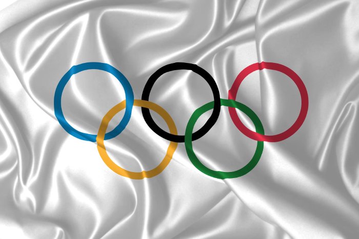 A white cloth with the Olympic rings on it.