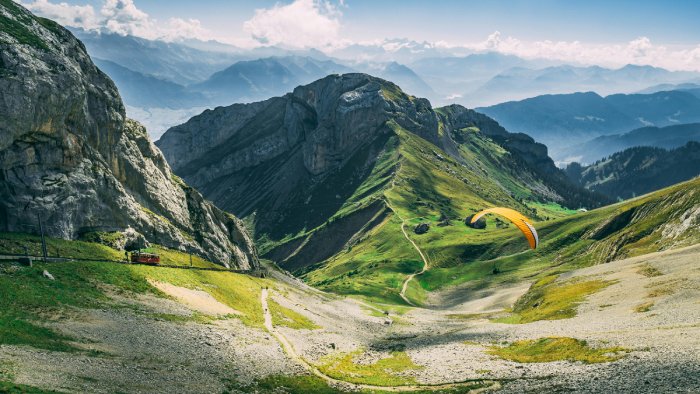 A paraglide down a Swiss mountain valley.