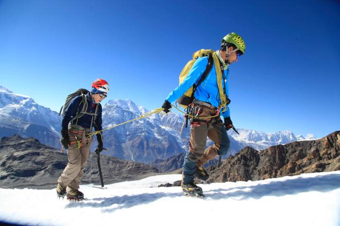 Two trekkers in Nepal roped together