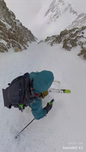 Skiing down a steep chute on Denali.