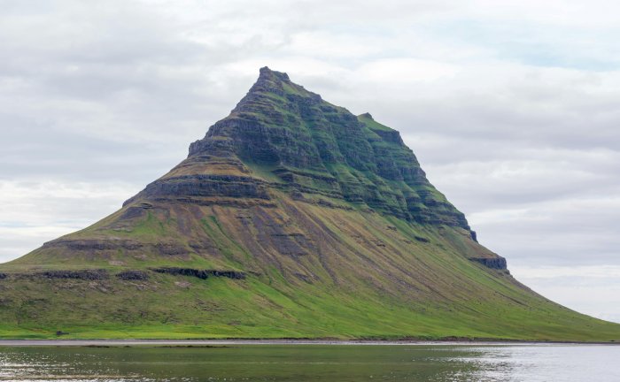 A dramatic peak rises from the sea in the Snæfellsnes Peninsula in Iceland.