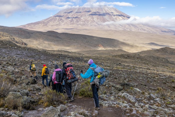 Climbers make their way toward Kilimanjaro's base.